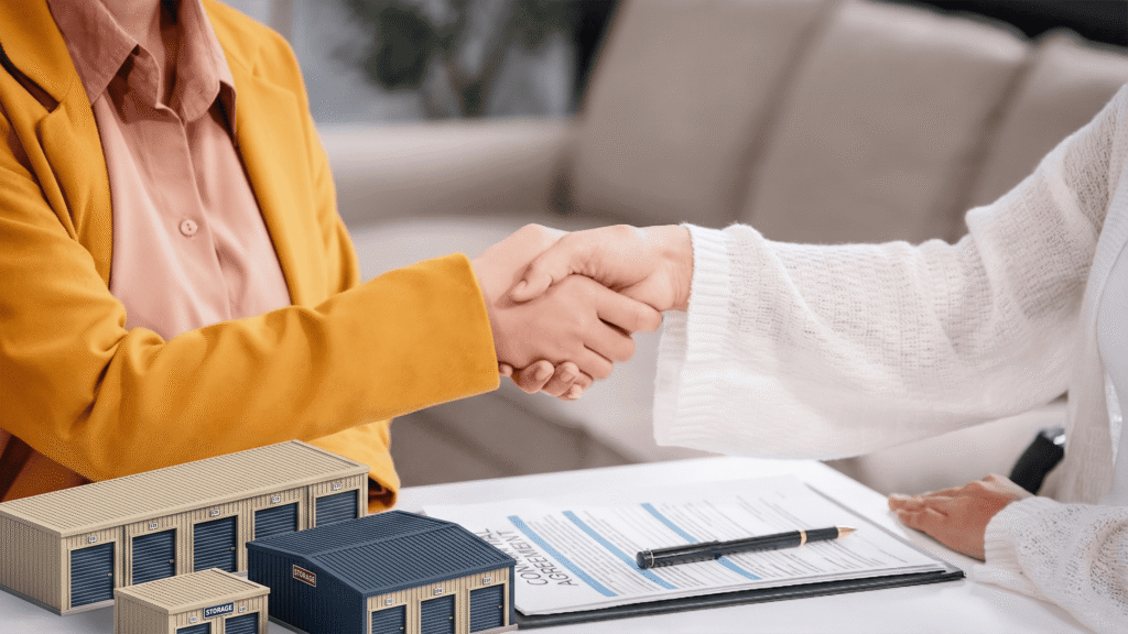 Handshake over contract representing a self storage investment agreement